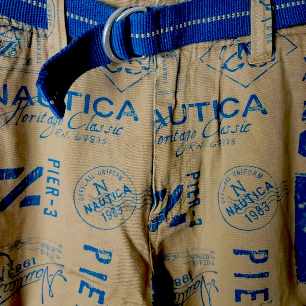 Nautical size 5 with buttons to adjust the fit  of the shorts and has blue belt